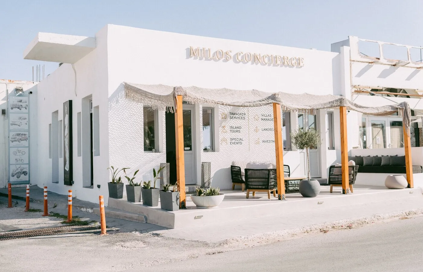 The Milos Concierge office: a white building with a shaded terrace
